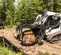 Chargeuse à chenilles compacte BOBCAT blanche, noire et rouge 1 542 kg