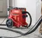Aspirateur à poussière de béton eau/poussière HILTI rouge et noir, électrique